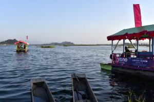 Tourists enjoying ride in boat in Loktak Lake at Moirang under Bishnupur district in Manipur, India on Thursday, 22 November, 2018. Loktak Lake is the largest freshwater lake in Northeast India and is famous for the phumdis floating over it. (Photo by David Talukdar/NurPhoto via Getty Images)